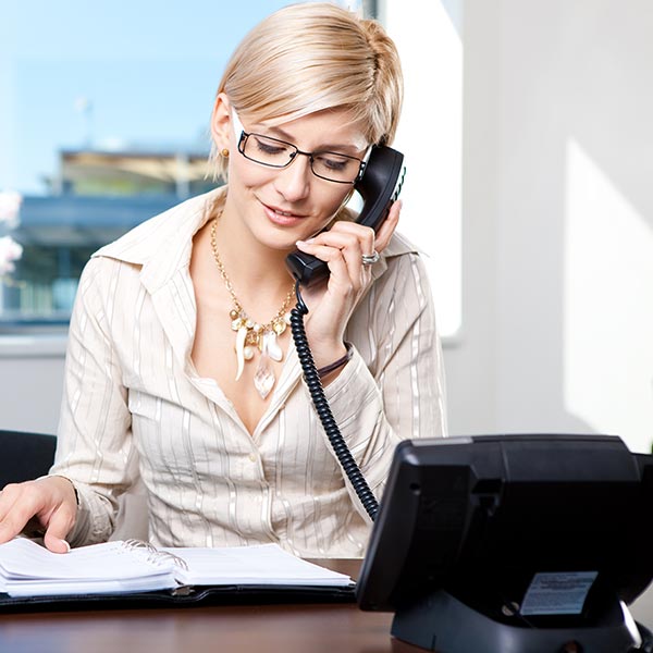 woman using telephone system